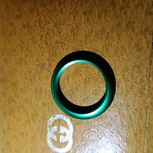 Gucci interchangeable bezels metal bezel in green metal.